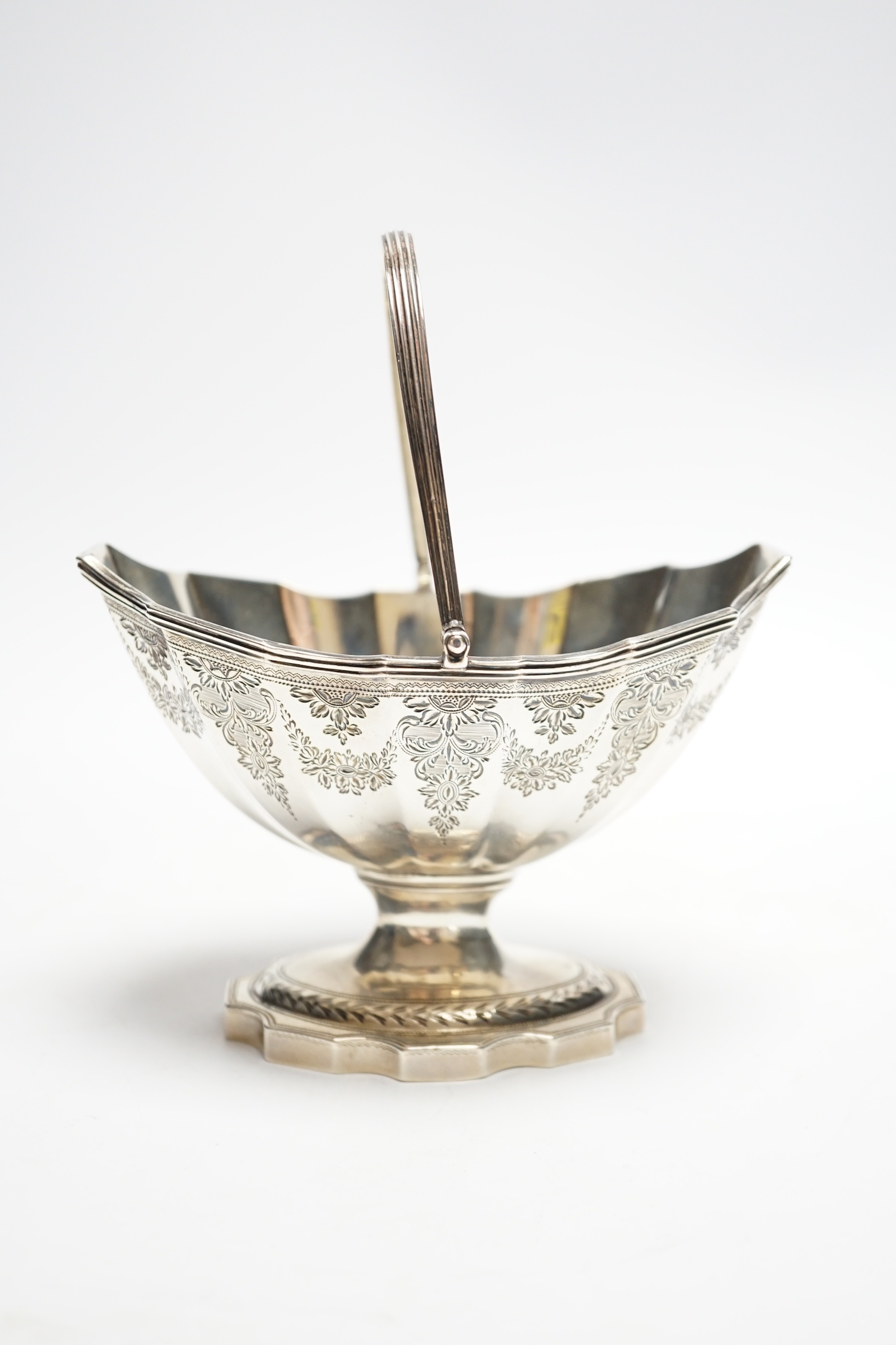 A George III silver boat shaped pedestal sugar basket, John Hutson, London, 1788, length 13.2cm, 5.6oz.